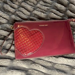 Michael Kors burgundy patent wristlet/clutch